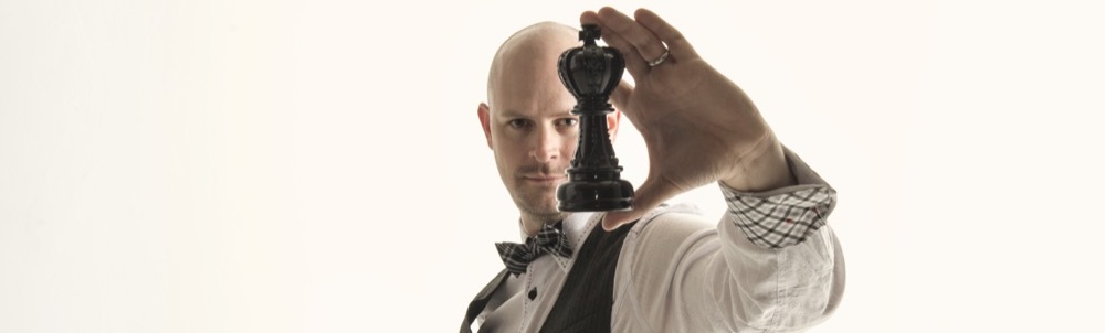 Matt Adams holding a chess piece