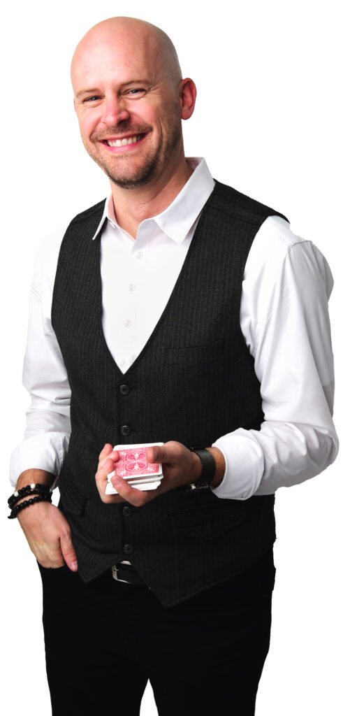 Matt Adams, professional headshot in vest holding cards